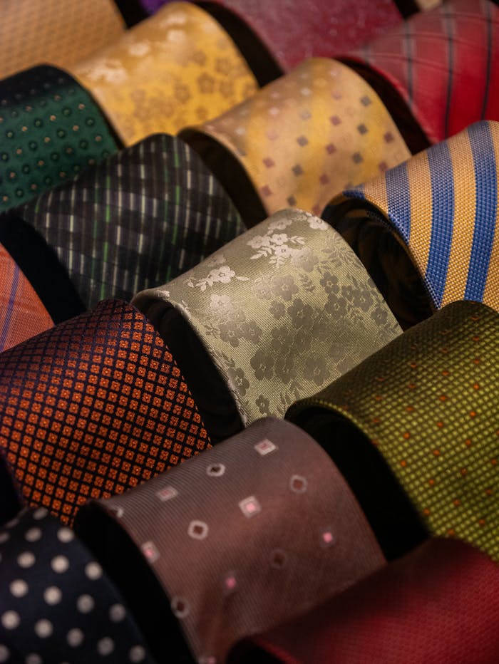 Colorful silk ties with varied patterns displayed in an elegant arrangement.
